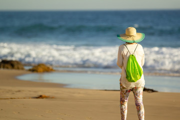 Woman walking on beach