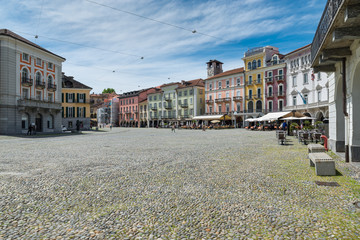 Locarno, Switzerland, square Grande (piazza Grande) with shops and restaurants located in the historic center of the city. Locarno is an important tourist city located on lake Maggiore - obrazy, fototapety, plakaty