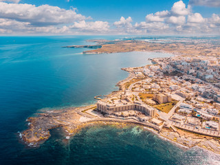 City Marsaskala Malta summer harbour water mediterranean sea blue. Aerial top view - obrazy, fototapety, plakaty