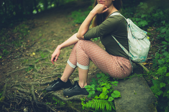 Young woman relaxing in the woods