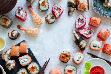 Top view of japanese sushi set nigiri and sushi rolls served with wasabi and ginger