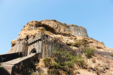 Fototapeta na wymiar Entrance gate and side view of Lohagad Fort, Pune district, Maharashtra, India