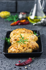 Honey mustard roasted chicken breast  with rosemary and olive oil. Selective focus, space for text.