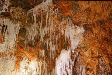 Old mine with white natural stalactites. Cardona Salt Mountain Cultural Park. Cardona, Spain.