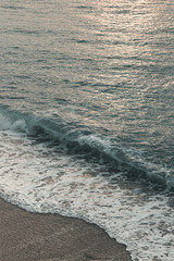 epic dawn and sea with waves and foam