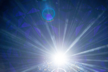 Abstract sparkling light rays and lighting flare bokeh.