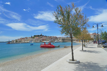 Promenade in beautiful historic harbour town Primosten with nice beaches, clear sea and sun