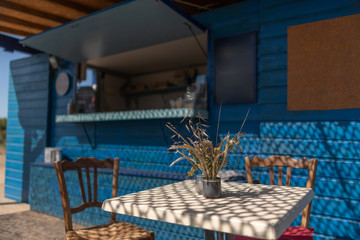 A table at a beach bar, in Corsica