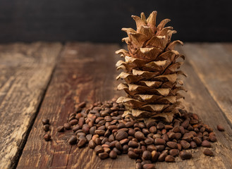 inshell pine nuts and a lump on a wooden table. Copy space for your text