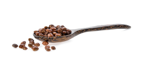 Obraz premium Nuts seed in wood spoon on white background