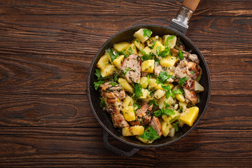 Roasted in a pan with spices and herbs. Potato and meat fried for dinner.