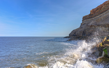 Cliff and waves.