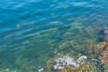                      Stone beach of mediterranian sea, sea coast. Natural background.           