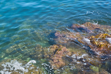                      Stone beach of mediterranian sea, sea coast. Natural background.           