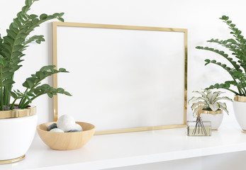 Golden frame leaning on white shelve in interior with plants and decorations mockup 3D rendering