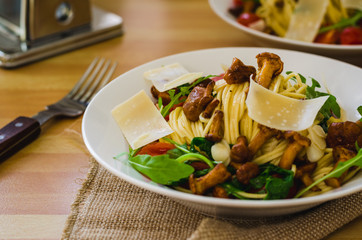 Homemade Tagliolini with Wild Chanterelles Cherry Tomatoes and Rocket