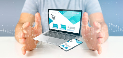 Businessman holding a Laptop and a smartphone - 3d rendering