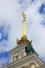 Architecture building with old statues and golden spire in Moscow 