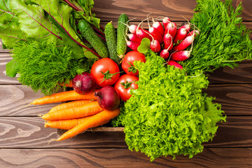 Mix of vegetables on wooden background. Top view