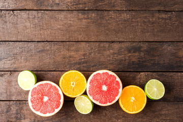 Fresh citruses on wooden table with copyspace