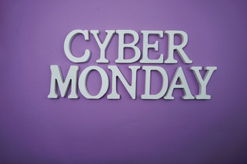 Cyber Monday Sale alphabet letters on purple background business concept