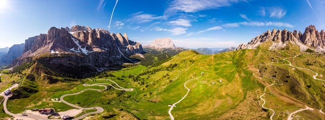 Dolomites - Beautiful panoramic sunset landscape at Gardena Pass (Passo Giau) near Ortisei. Stunning airial view on the top Dolomiti Alps Mountains from drone on summer day, Italy, south Tyrol Europe