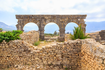 Fototapeta na wymiar Arches at the ruins of Volubilis, ancient Roman city in Morocco.