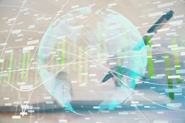 Fototapeta premium International business hologram over woman's hands taking notes background. Concept of success. Double exposure