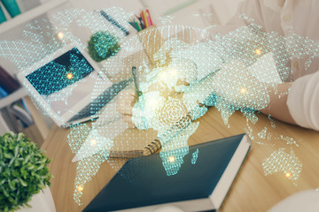 International business hud over woman's hands writing background. Concept of hard work. Double...