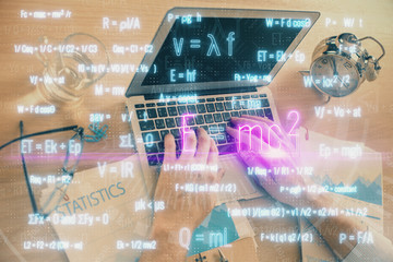 Science formula hologram with man working on computer on background. Education concept. Double...