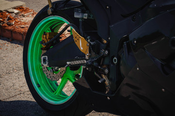 sports bike black with green wheels photo rear wheel