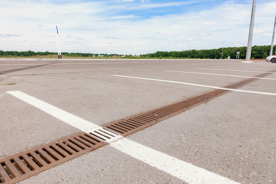 water grate in the parking lot.