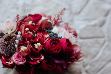 Pink rose flowers bouquet on light stone background