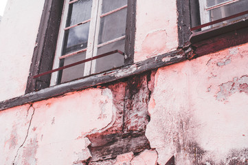Ruin of a large brick house after a fire in the attic to clarify fire damage Arson theft and vandalism
