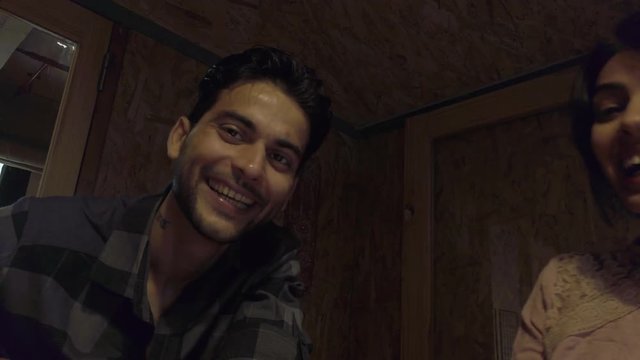 Entrepreneurs casual workers having fun while they cowork on laptop to share ideas plans make dreams and reach impossible with hard-work and teamwork together. 4k handheld 60 fps medium-shot gimbal