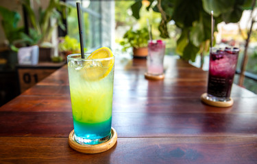 Blue Hawaii Cocktail on wooden table.