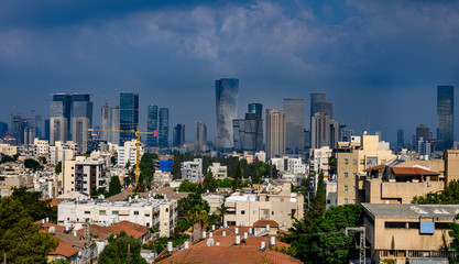 Fototapeta na wymiar Tel Aviv skyline in early morning. Rooftop view to the city. Old houses and new modern skyscrapers.