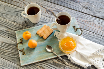 Morning tea with apricot jam close-up