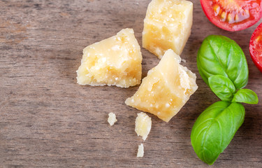 Pieces of Parmesan Reggiano and basil
