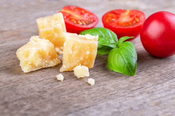 Pieces of Parmesan Reggiano and basil