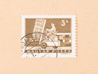 HUNGARY  - CIRCA 1964: A stamp printed in Hungary shows working at a trainstation, circa 1964