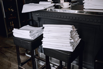 pile of tablecloth in a restaurant