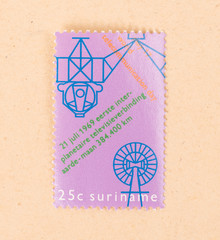 SURINAME - CIRCA 1980: A stamp printed in Suriname shows the first interplanet...