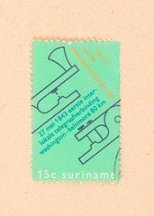 SURINAME - CIRCA 1980: A stamp printed in Suriname shows world communication day, circa 1980