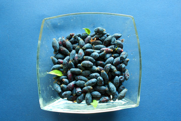 Berries in a bowl. Honeysuckle. Blue berry.