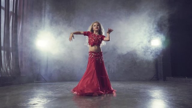 Caucasian children girl dancing belly dance