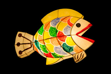 Fish lantern by paper work in dark background.
