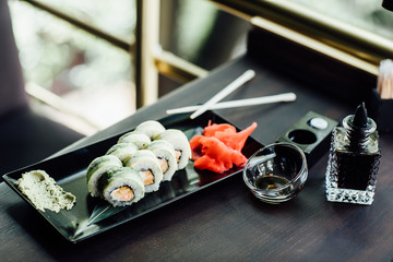 Fresh and delicious maki and nigiri sushi and sake glass.