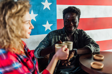 Portrait of  man with best friends sitting on cafe ,drinking coffee and speaking.