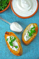 Croutons with sour cream and greens. Chopped green onions and sour cream. Sour cream. Fermented milk product. Probiotics.
